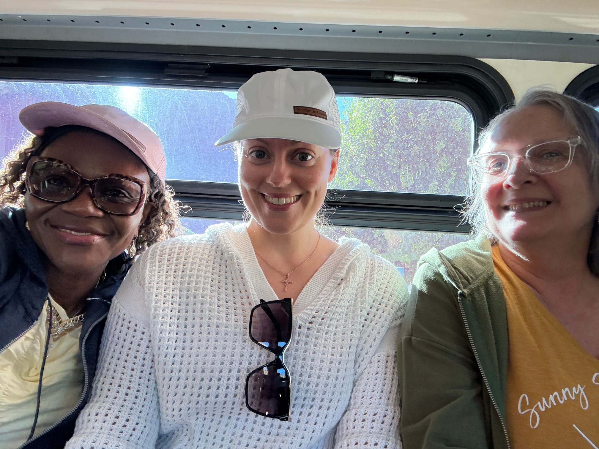 Women attending the No More Dry Ground Retreat riding the Zion Canyon shuttle together before hiking The Narrows.