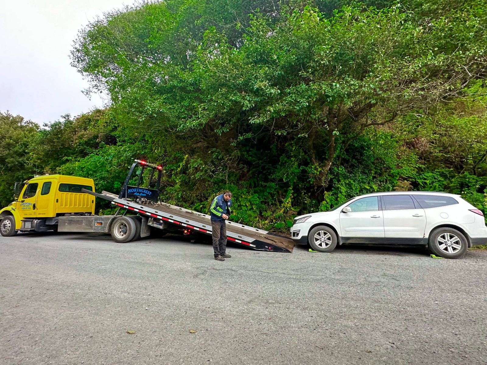 Tow truck preparing to transport my white SUV after I lost my keys in the ocean near Klamath, California