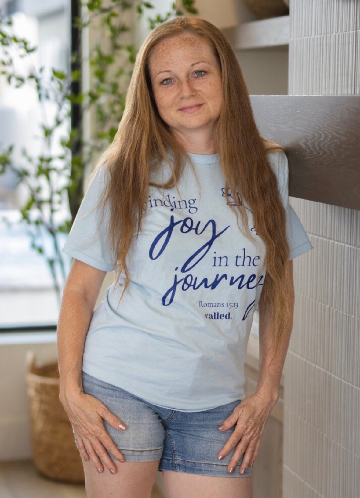 Meet Sharla of Sharla’s Wanderlust Adventures Sharla, creator of Sharla’s Wanderlust Adventures, wearing a Finding Joy in the Journey shirt
